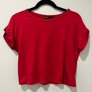 Red slightly cropped tshirt with rolled sleeves size S